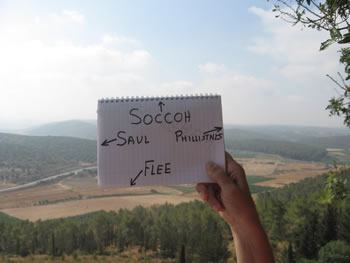 Toni holds the notebook with the labels of the sites