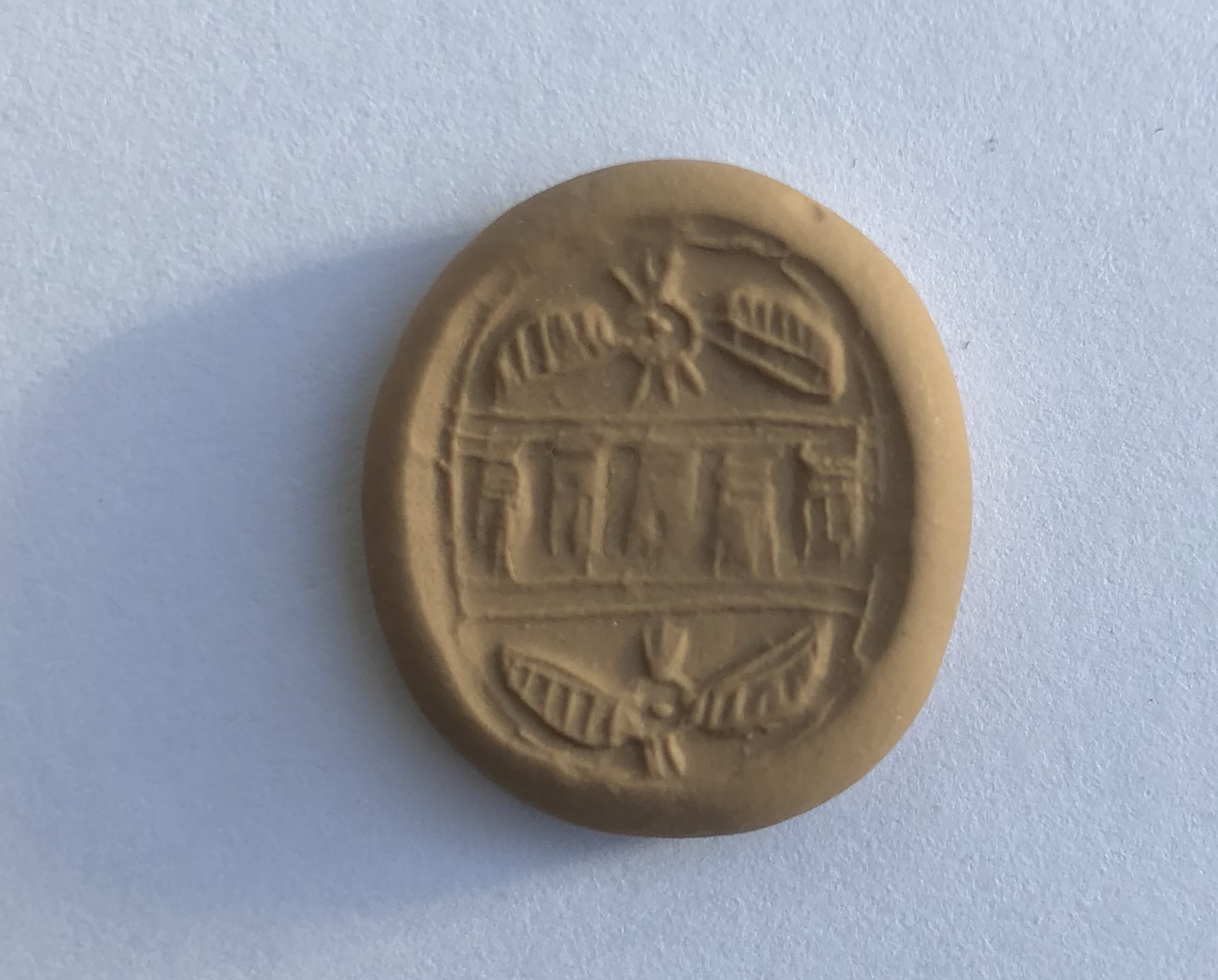 700 BC Seal in Black Hued Stone with Two Winged Sun Disc Modern Impression