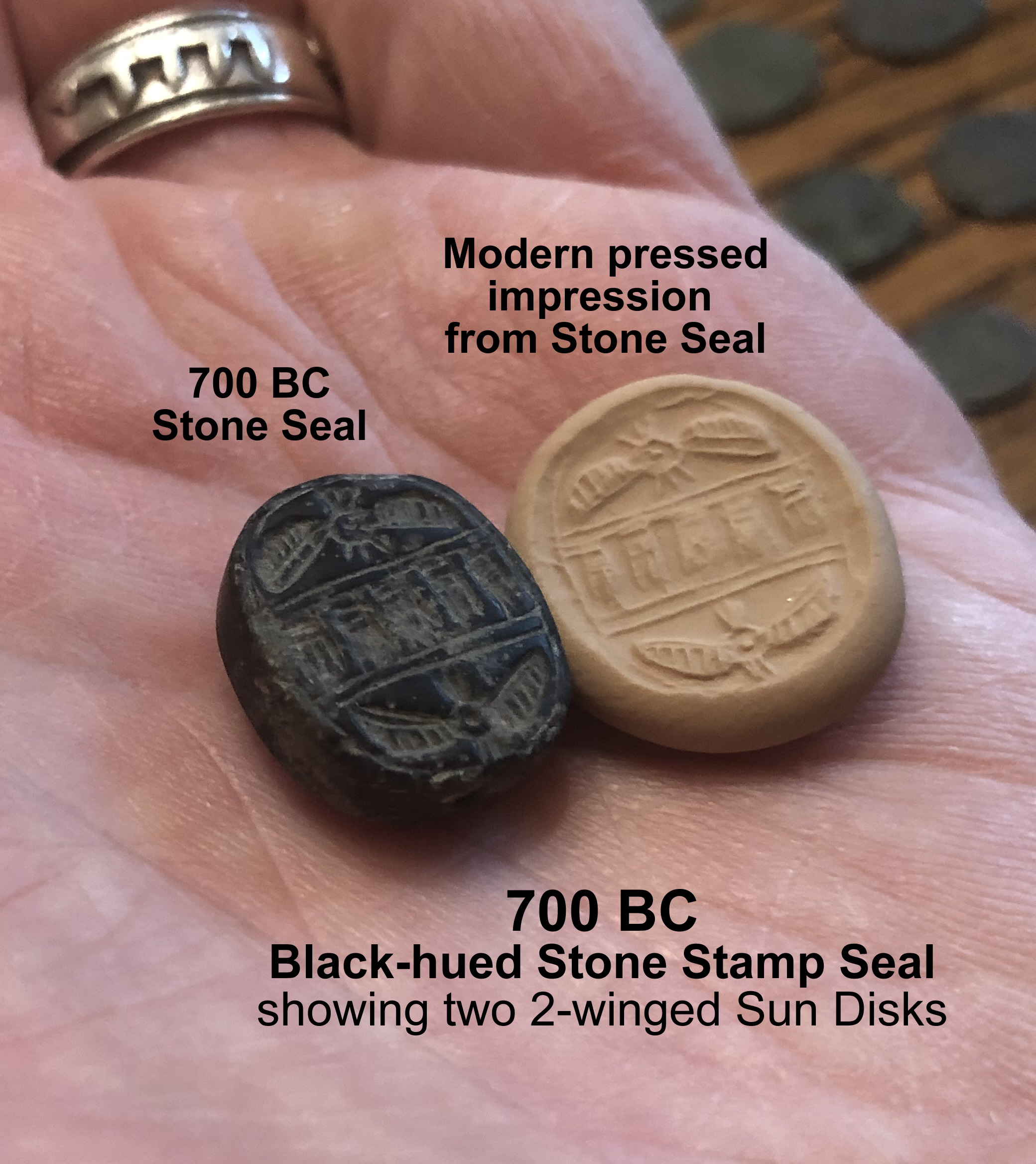 700 BC Seal in Black Hued Stone with Two Winged Sun Disc and Modern Pressed Impression